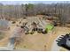 Lush backyard featuring a sports turf, bordered by an iron fence, with a beautiful house beyond at 1348 Ewing Creek Dr, Dacula, GA 30019