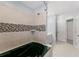 Bathroom featuring soaking tub with tiled surround, tiled shower, and vanity at 1348 Ewing Creek Dr, Dacula, GA 30019