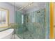 Stunning bathroom featuring a glass shower with dual shower heads and a luxurious soaking tub with gold trim and fixtures at 1348 Ewing Creek Dr, Dacula, GA 30019