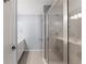 Bathroom features tiled shower, white vanity and tile floors at 1348 Ewing Creek Dr, Dacula, GA 30019