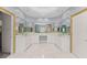 Modern bathroom with white cabinets, double sinks and gold hardware at 1348 Ewing Creek Dr, Dacula, GA 30019