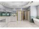 Bathroom with double sinks, bathtub and walk-in closet access at 1348 Ewing Creek Dr, Dacula, GA 30019