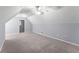 Spacious bedroom featuring neutral carpet, light blue walls, and a ceiling fan at 1348 Ewing Creek Dr, Dacula, GA 30019
