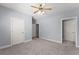 Bedroom featuring neutral carpet, light blue walls and white doors at 1348 Ewing Creek Dr, Dacula, GA 30019
