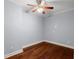 Bedroom with hardwood floors and a ceiling fan at 1348 Ewing Creek Dr, Dacula, GA 30019