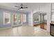 Sunlit dining area featuring tile flooring, arched doorway, and access to patio at 1348 Ewing Creek Dr, Dacula, GA 30019