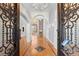 Grand foyer showcasing a soaring ceiling, hardwood floors, and an elegant chandelier at 1348 Ewing Creek Dr, Dacula, GA 30019
