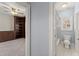 Bright hallway connecting the office to the bathroom, showcasing an open layout and seamless transition between spaces at 1348 Ewing Creek Dr, Dacula, GA 30019