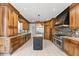 Gourmet kitchen featuring custom cabinets, granite countertops, stainless steel appliances, and an island at 1348 Ewing Creek Dr, Dacula, GA 30019