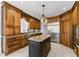 Beautiful kitchen featuring custom cabinets, granite countertops, stainless steel appliances, and an island at 1348 Ewing Creek Dr, Dacula, GA 30019