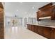 Spacious kitchen with cherry cabinets and french doors leading outside at 1348 Ewing Creek Dr, Dacula, GA 30019