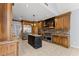 Gourmet kitchen featuring custom cabinets, granite countertops, stainless steel appliances, and an island at 1348 Ewing Creek Dr, Dacula, GA 30019