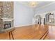 Spacious living room with stone fireplace, hardwood floors, and large windows at 1348 Ewing Creek Dr, Dacula, GA 30019