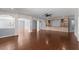 Spacious living room with hardwood floors, built-in shelving, and archways at 1348 Ewing Creek Dr, Dacula, GA 30019