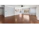Expansive living room with hardwood flooring, elegant crown molding, and lots of natural light at 1348 Ewing Creek Dr, Dacula, GA 30019