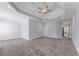 Large living room featuring gray carpet, recessed lights and tray ceiling at 1348 Ewing Creek Dr, Dacula, GA 30019