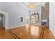 A spacious living room features a stone fireplace, hardwood floors, large window, and decorative trim at 1348 Ewing Creek Dr, Dacula, GA 30019