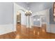 Spacious living area with hardwood floors, custom arches, and a stunning stone fireplace at 1348 Ewing Creek Dr, Dacula, GA 30019
