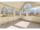 Inviting screened porch offering a serene view of the surrounding trees and natural landscape, perfect for relaxation at 1348 Ewing Creek Dr, Dacula, GA 30019