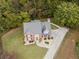 Aerial view of the property showcasing the home, surrounding greenery, and driveway at 3500 Parkwood Hills Ct, Snellville, GA 30078