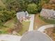 A bird's eye view of the property with manicured lawns and mature trees, highlighting the home's setting at 3500 Parkwood Hills Ct, Snellville, GA 30078