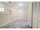 Neutral bedroom featuring gray vinyl flooring, white trim, closet, and a window at 3500 Parkwood Hills Ct, Snellville, GA 30078