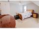 Comfortable bedroom with a ceiling fan, natural light, and neutral tones at 3500 Parkwood Hills Ct, Snellville, GA 30078