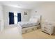 Bedroom with gray walls, carpet, white trim and bed frame, with blue curtains at 3500 Parkwood Hills Ct, Snellville, GA 30078