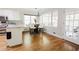 Bright breakfast nook with large windows, chandelier, and access to outdoor patio at 3500 Parkwood Hills Ct, Snellville, GA 30078