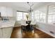 Cozy breakfast nook featuring a chandelier and a table set for four at 3500 Parkwood Hills Ct, Snellville, GA 30078