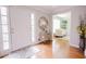 Bright and welcoming foyer with hardwood floors and stylish decor at 3500 Parkwood Hills Ct, Snellville, GA 30078