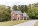 Traditional two-story brick home with black shutters and a well-maintained lawn at 3500 Parkwood Hills Ct, Snellville, GA 30078