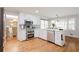 Modern kitchen featuring stainless steel appliances, granite countertops, and hardwood floors at 3500 Parkwood Hills Ct, Snellville, GA 30078