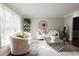 Elegant living room with neutral tones, plush seating, and decorative touches at 3500 Parkwood Hills Ct, Snellville, GA 30078
