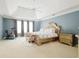 Large main bedroom suite with ample space, neutral colors, and comfortable furnishings at 3500 Parkwood Hills Ct, Snellville, GA 30078