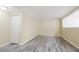 Bright room with gray wood-look floors, white trim and natural light at 3500 Parkwood Hills Ct, Snellville, GA 30078