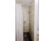 Shower featuring white tile walls and shower curtain at 3500 Parkwood Hills Ct, Snellville, GA 30078