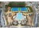 Aerial view of community pool, playground, and tennis courts with mature landscaping at 650 Village Crest Dr, Suwanee, GA 30024