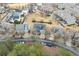 Aerial view of a neighborhood featuring mature trees, manicured lawns, and well-maintained homes at 650 Village Crest Dr, Suwanee, GA 30024