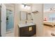 Modern bathroom with a sleek vanity, tile floors, and a glass shower at 650 Village Crest Dr, Suwanee, GA 30024