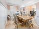 Elegant dining room with wainscoting, modern chandelier, and farmhouse-style table at 650 Village Crest Dr, Suwanee, GA 30024