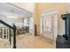 Inviting entryway with hardwood floors, shutters, and a view into the dining room at 650 Village Crest Dr, Suwanee, GA 30024