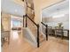 Spacious foyer with hardwood floors, staircase, and view into the dining room and living room at 650 Village Crest Dr, Suwanee, GA 30024