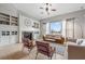Spacious living room features fireplace, hardwood floors, and neutral colors at 650 Village Crest Dr, Suwanee, GA 30024