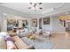 Inviting living room showcasing a blend of comfortable seating, with an adjacent kitchen area visible in background at 650 Village Crest Dr, Suwanee, GA 30024