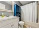 Well-lit bathroom with white vanity, toilet, and shower with curtain at 981 Cobb Place Manor Dr, Marietta, GA 30066