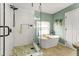 Updated bathroom featuring a soaking tub and glass enclosed shower with white tile surround at 981 Cobb Place Manor Dr, Marietta, GA 30066