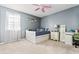 Bedroom featuring neutral paint, carpet, window with blinds and natural light at 981 Cobb Place Manor Dr, Marietta, GA 30066