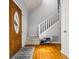 Bright foyer featuring hardwood floors, a staircase, and an exterior door at 981 Cobb Place Manor Dr, Marietta, GA 30066