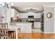 Bright kitchen features stainless steel appliances, granite countertops, and hardwood floors at 981 Cobb Place Manor Dr, Marietta, GA 30066